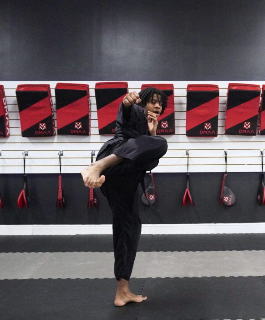 Adult Martial Arts students practicing self-defense techniques in Nottingham dojo